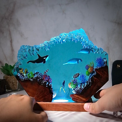 Killer whales swim with seals and humans Resin lamp