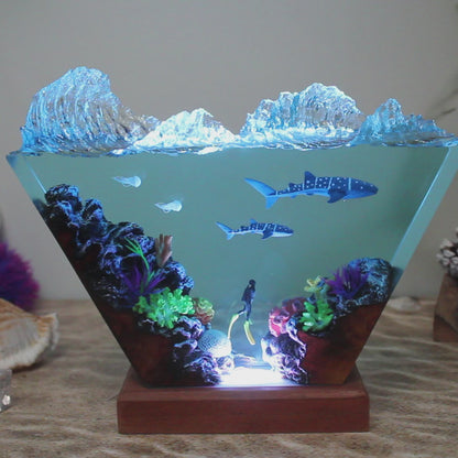 Ocean resin lamp. Sharks and humans in the sea