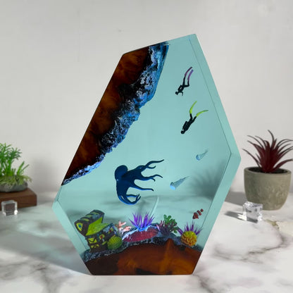 Ocean resin lamp.  Octopus and humans head towards the treasure