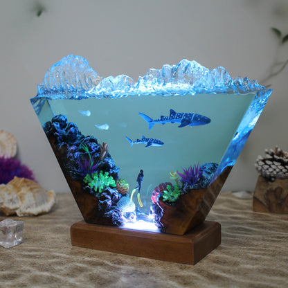 Ocean resin lamp. Sharks and humans in the sea