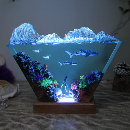 Ocean resin lamp. Sharks and humans in the sea