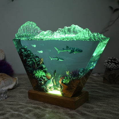 Ocean resin lamp. Sharks and humans in the sea